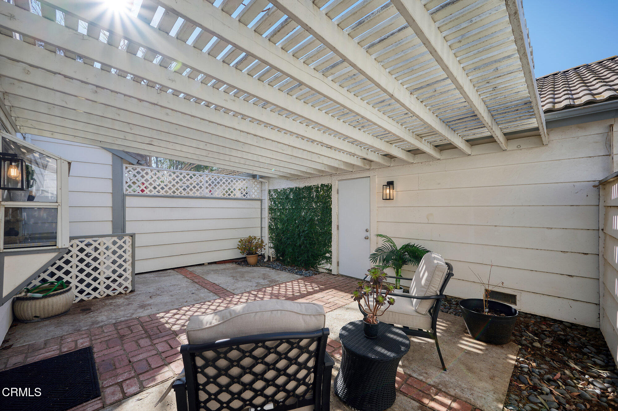 355 Jeremiah Drive, Unit D Simi Valley, CA 93065 - Photo 42 of 57 a view of a patio with two chairs and potted plants