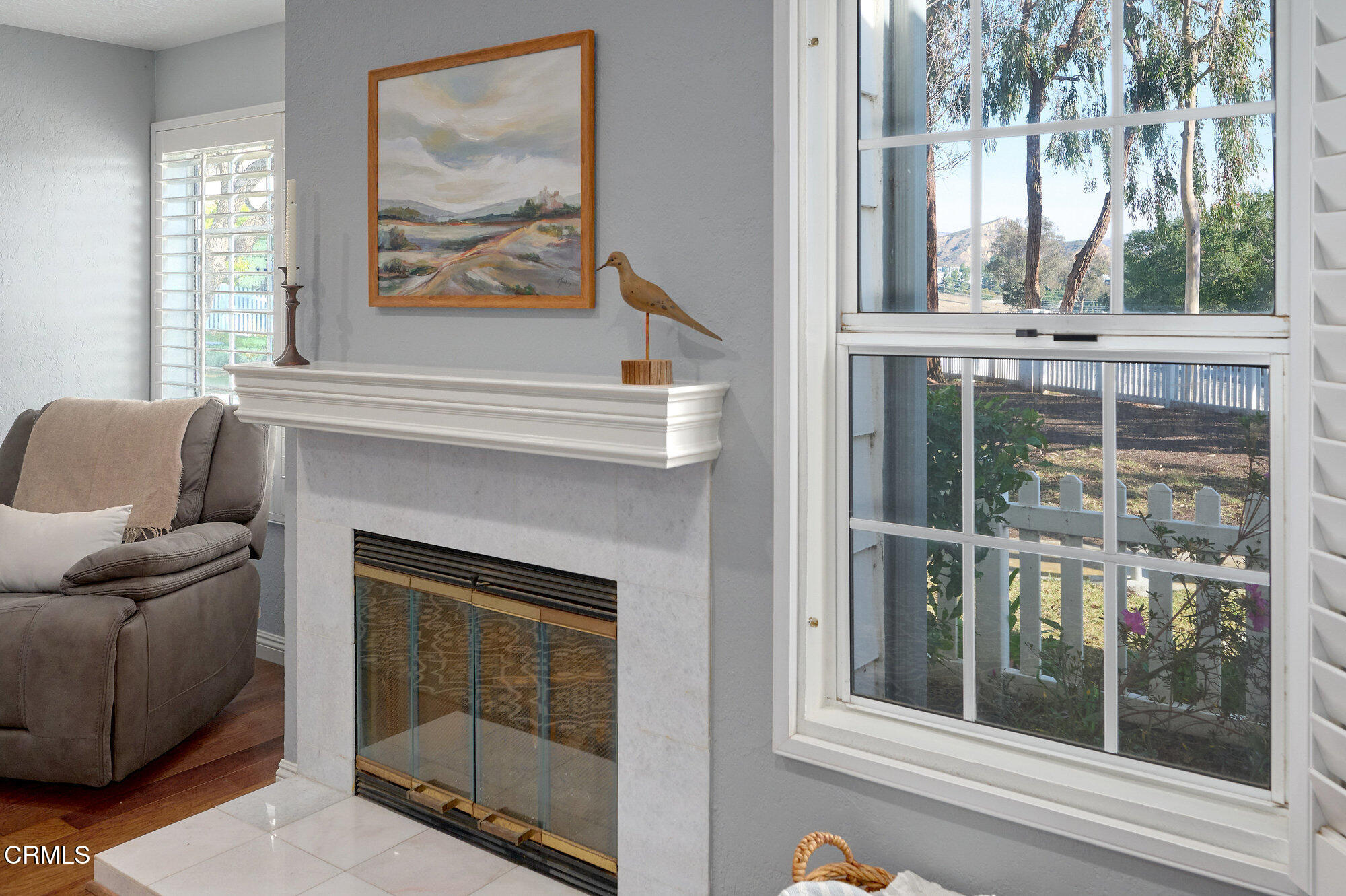 355 Jeremiah Drive, Unit D Simi Valley, CA 93065 - Photo 7 of 57 a living room with a fireplace and a large window