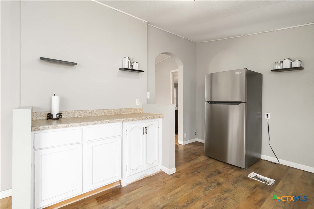 182 Pintail Loop San Marcos, TX 78666 - Photo 13 of 26 a kitchen with a refrigerator and a sink