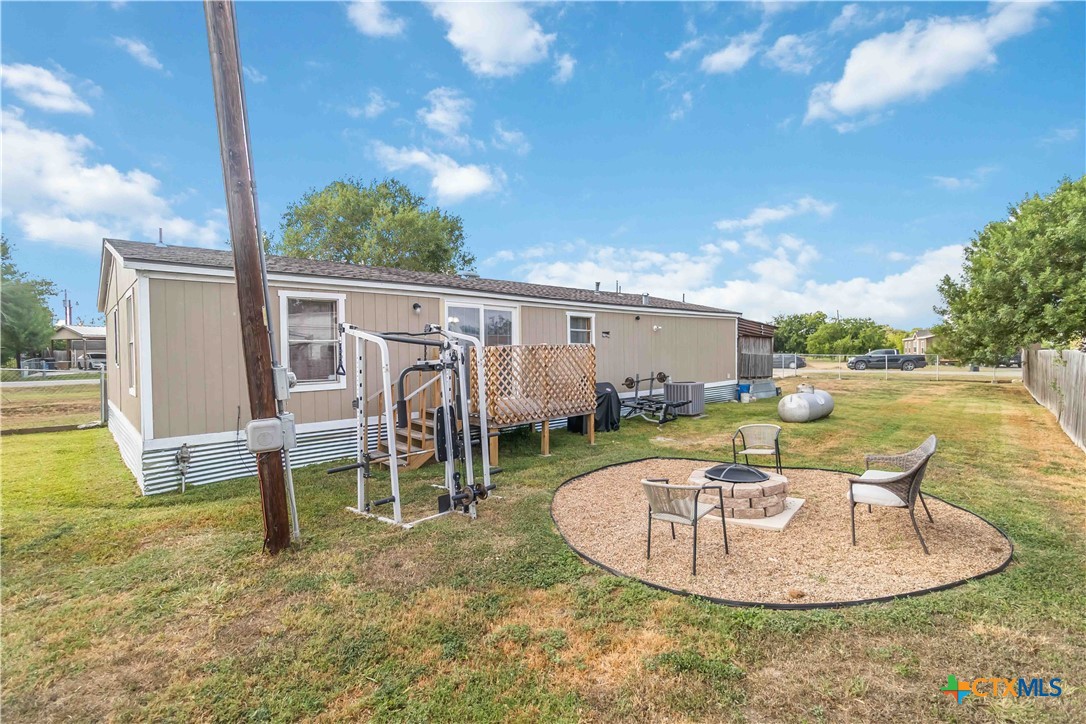 182 Pintail Loop San Marcos, TX 78666 - Photo 6 of 26 a view of a swimming pool with a patio and a yard