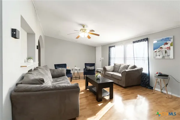 a living room with furniture and a large window