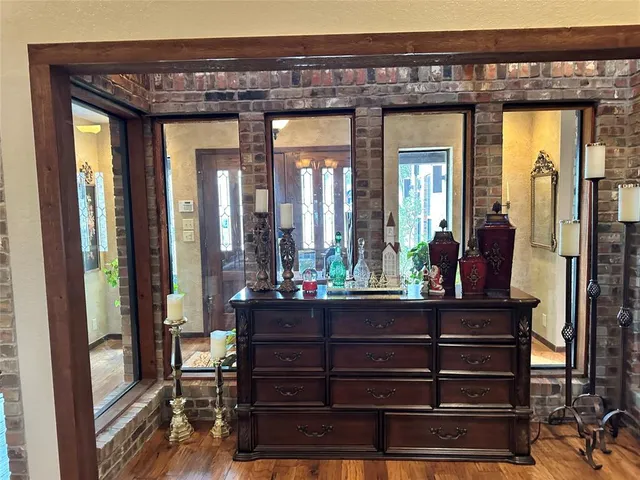 a room with a large window and furniture