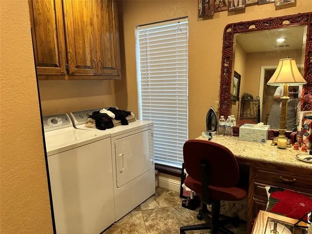 a bathroom with a sink a chair and painted walls