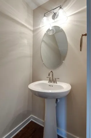 a bathroom with a sink a mirror and vanity
