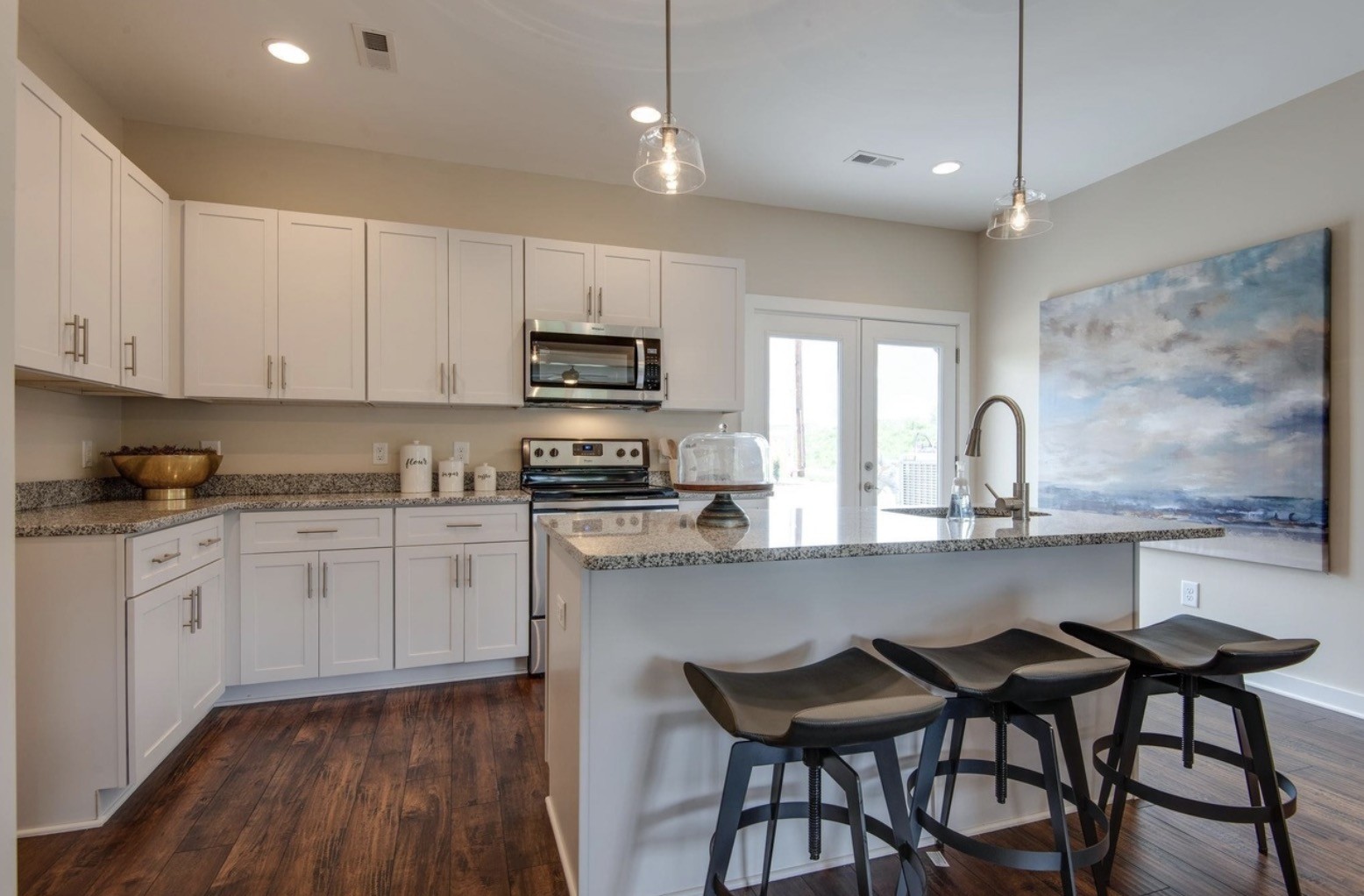 2404 Danilynn Drive Antioch, TN 37013 - Photo 7 of 12 a kitchen with sink a stove and chairs