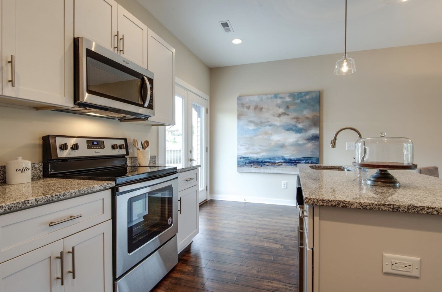 2404 Danilynn Drive Antioch, TN 37013 - Photo 8 of 12 a kitchen with stainless steel appliances granite countertop a stove a sink and a microwave