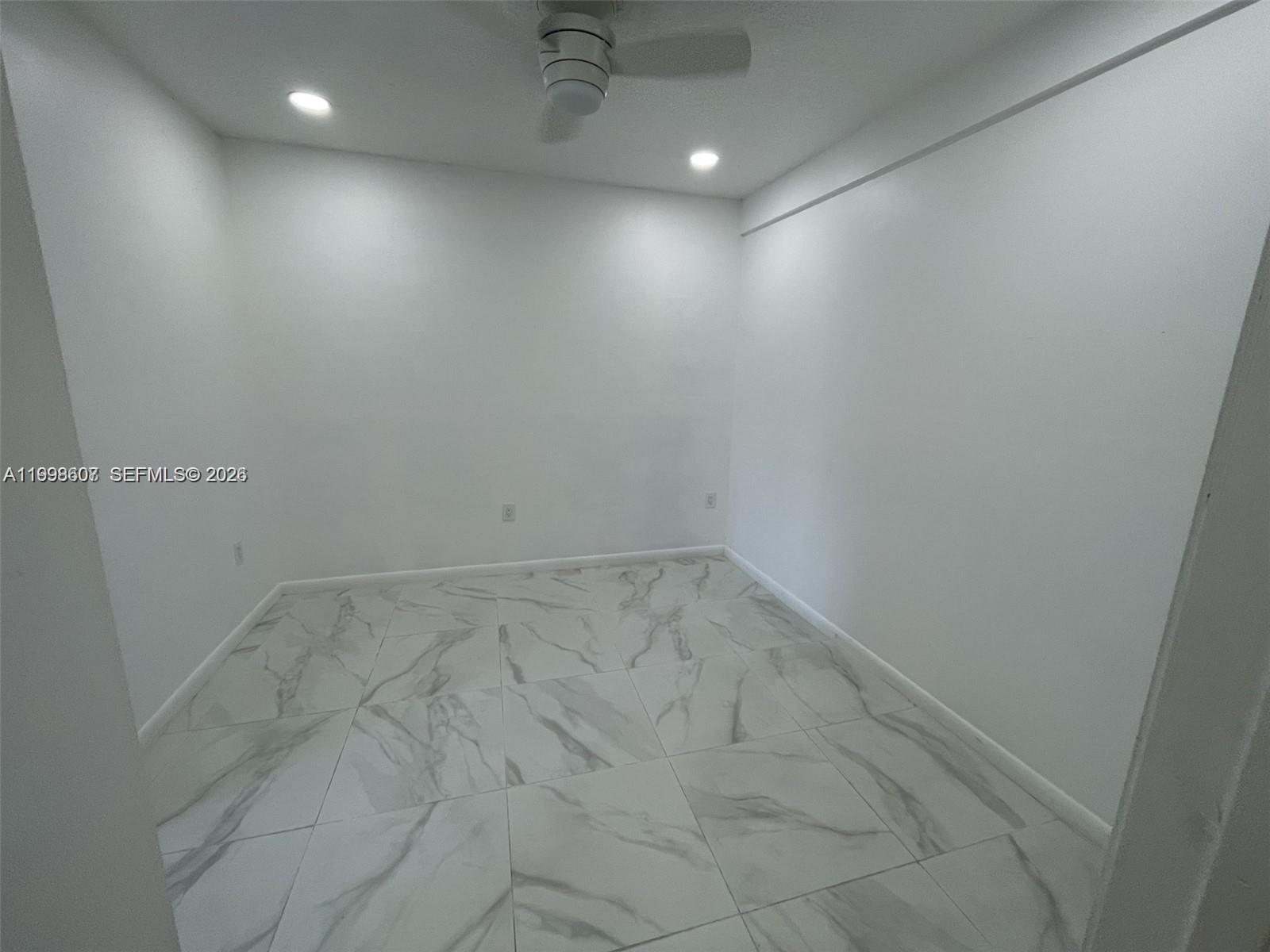 3403 Southwest 150th Court, Unit 1 Miami, FL 33185 - Photo 4 of 6 wooden floor in an empty room