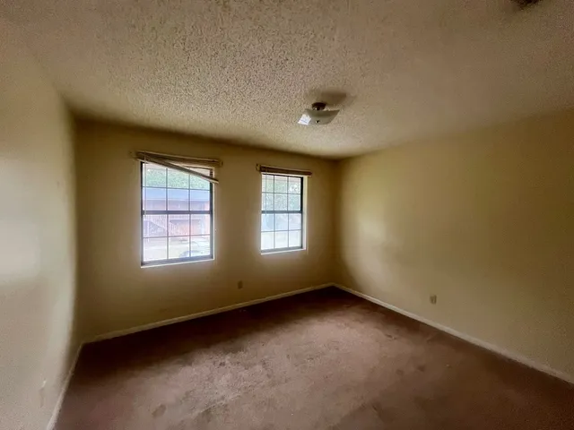 a bathroom with a shower and a sink