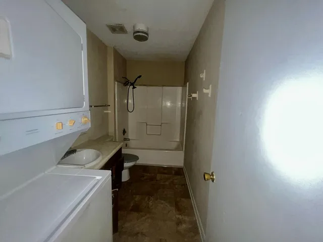 a kitchen with a stove and a refrigerator