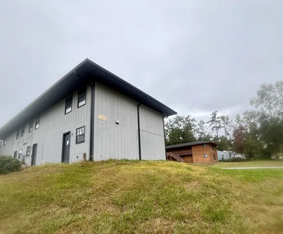 a house with trees in the background