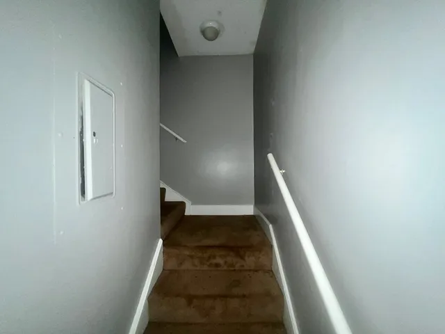 a white toilet sitting next to a bathroom sink