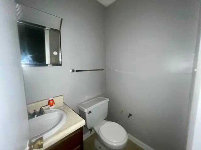 a view of a kitchen with a refrigerator