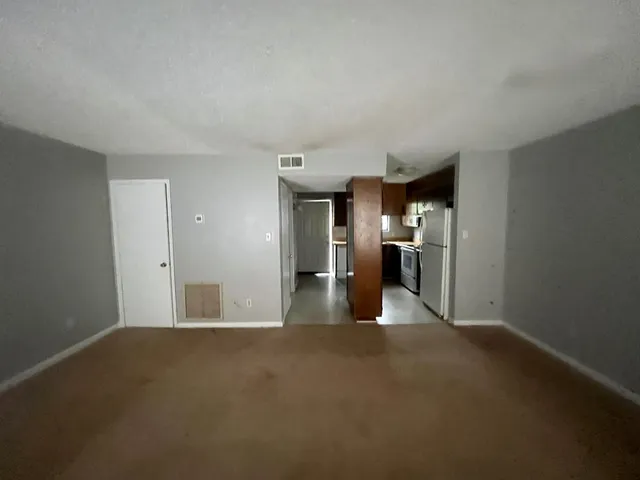 an empty room that has a window