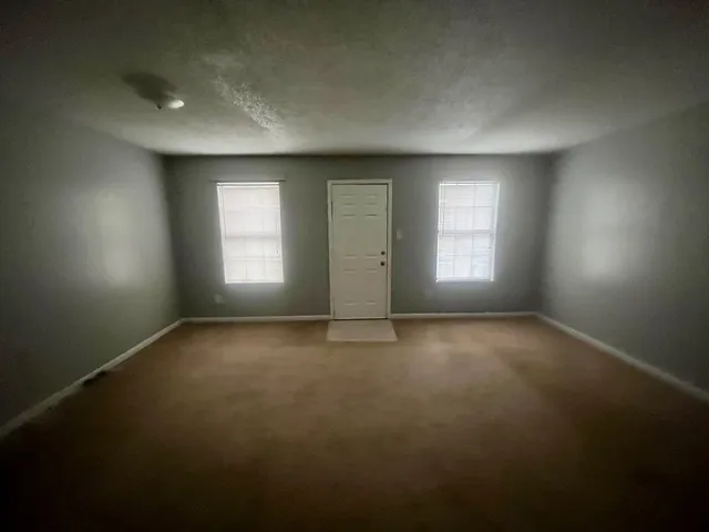 a kitchen with a stove and a refrigerator