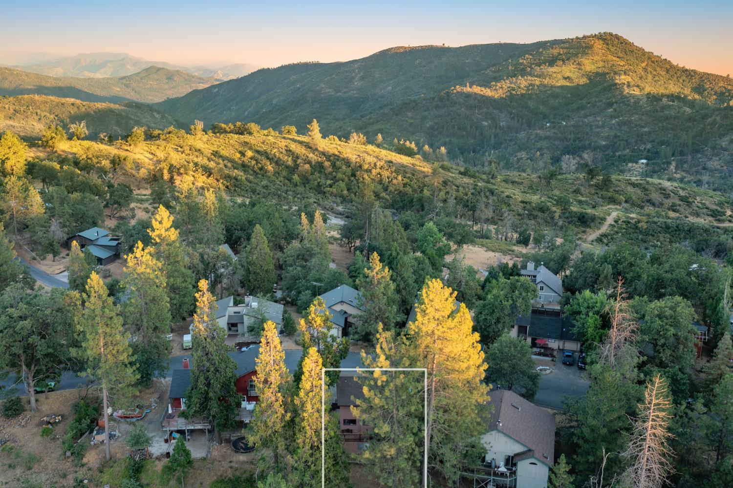 34065 Shaver Springs Road Auberry, CA 93602 - Photo 8 of 13 an aerial view of houses covered in trees