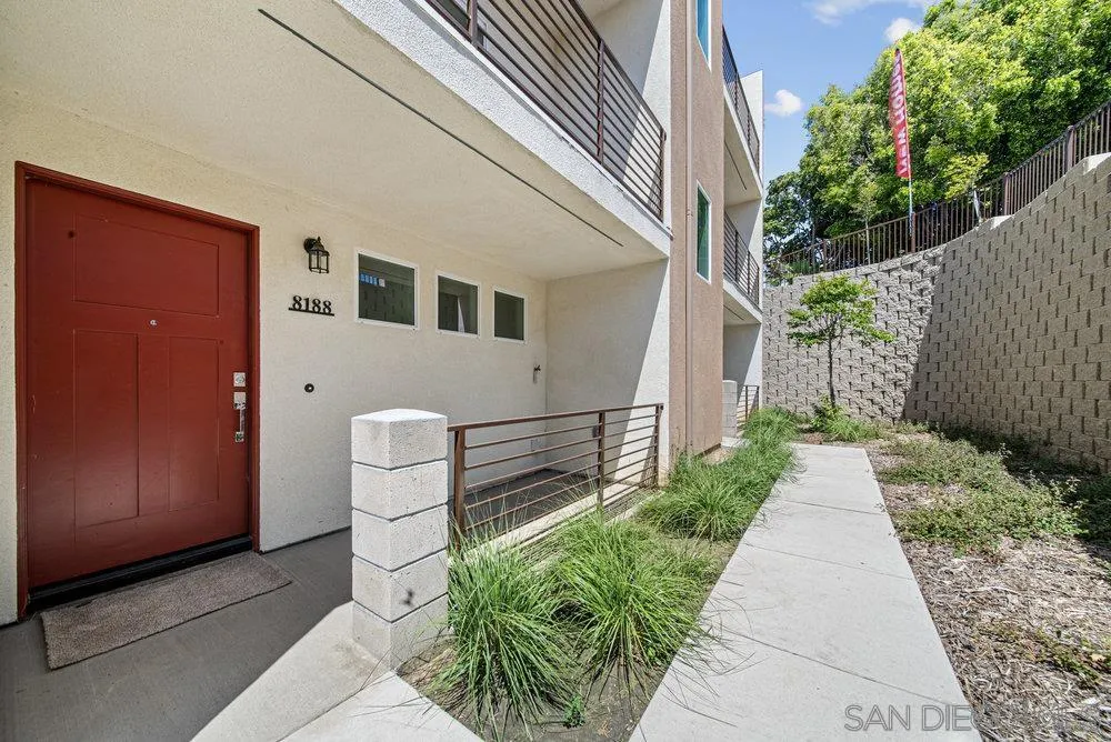 8188 Golden Avenue Lemon Grove, CA 91945 - Photo 2 of 47 a front view of a house with a garden