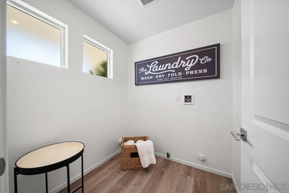 8188 Golden Avenue Lemon Grove, CA 91945 - Photo 6 of 47 a view of a hallway with wooden floor
