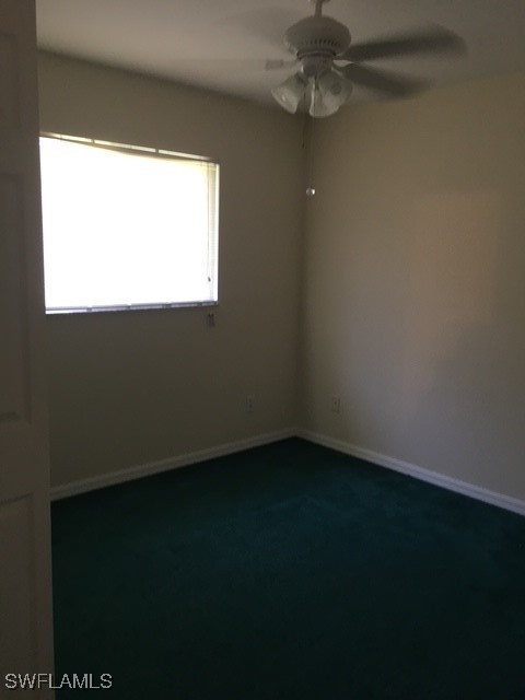 3527 Southwest 5th Street Cape Coral, FL 33991 - Photo 5 of 14 a view of an empty room with a window
