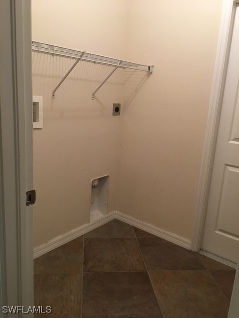 3527 Southwest 5th Street Cape Coral, FL 33991 - Photo 8 of 14 a view of a room with racks on the wall