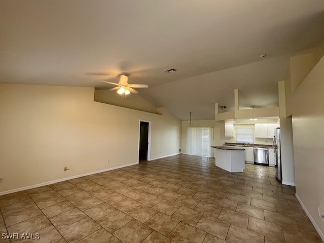 3527 Southwest 5th Street Cape Coral, FL 33991 - Photo 9 of 14 a view of a kitchen with a sink and chandelier