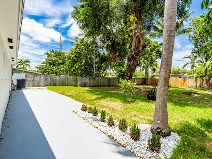 a view of swimming pool with a yard