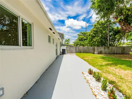a house view with a backyard space