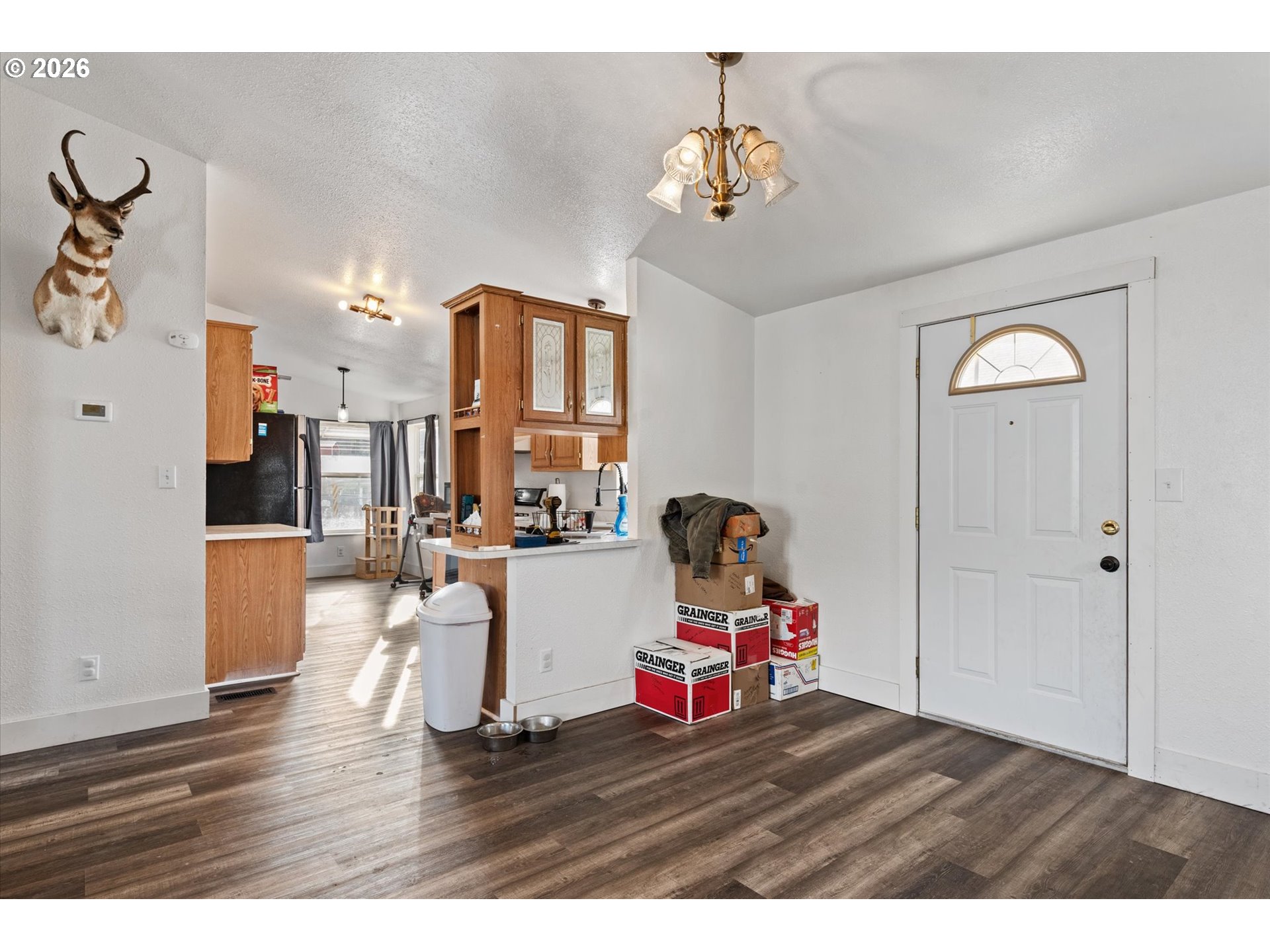 2106 Colorado Place Baker City, OR 97814 - Photo 15 of 40 a living room with furniture and a chandelier