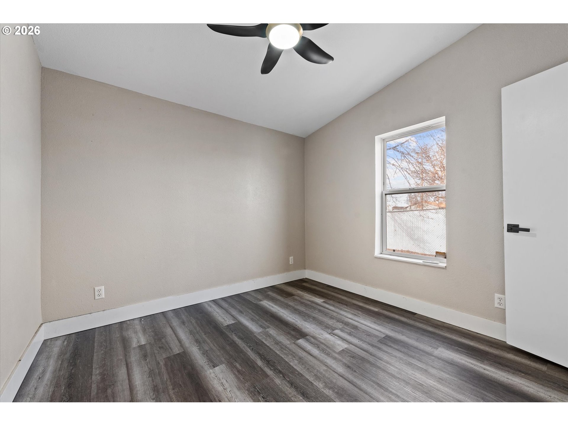 2106 Colorado Place Baker City, OR 97814 - Photo 18 of 40 wooden floor in an empty room with a window
