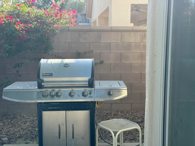 a kitchen with stainless steel appliances a refrigerator and a stove top oven