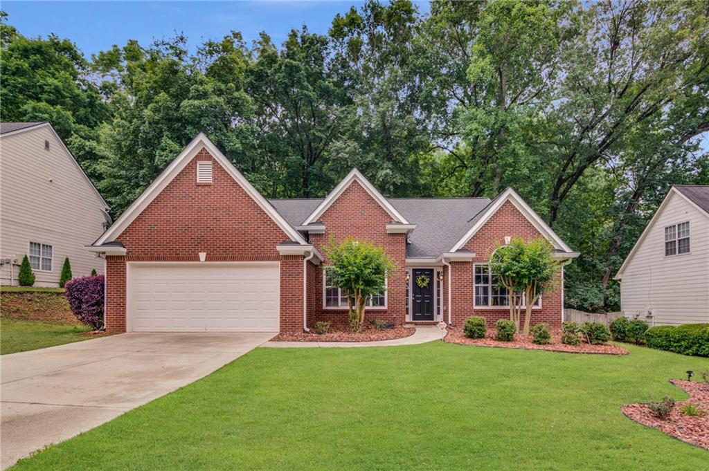 4395 Red Rock Point Suwanee, GA 30024 - Photo 1 of 1 a front view of a house with yard