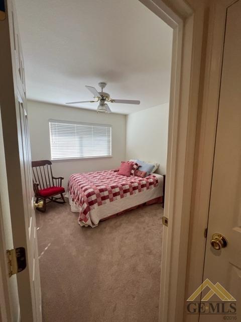 Undisclosed Address Tehachapi, CA 93561 - Photo 23 of 28 a bedroom with a bed and a chandelier
