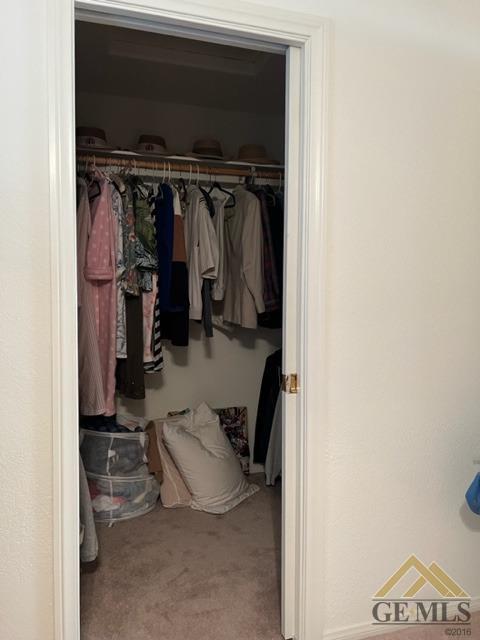 Undisclosed Address Tehachapi, CA 93561 - Photo 26 of 28 a view of walk in closet with clothes and shoes