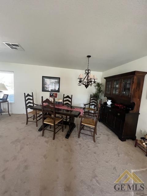 Undisclosed Address Tehachapi, CA 93561 - Photo 10 of 28 a living room with furniture and a chandelier