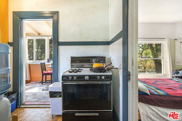 a kitchen with a sink cabinets and window