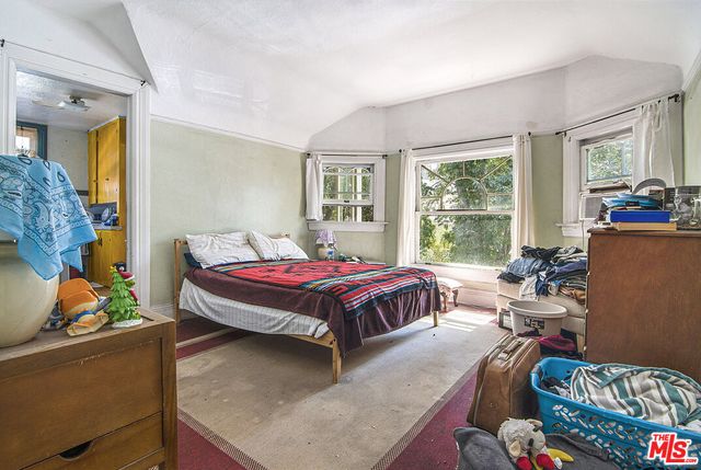 a bathroom with a black and white checkered floor