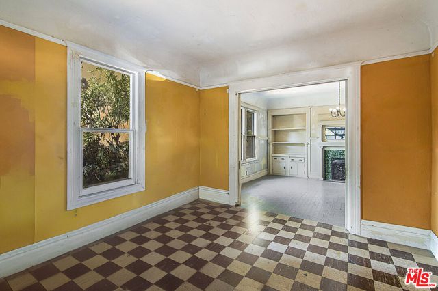 a living room with furniture fireplace and a chandelier