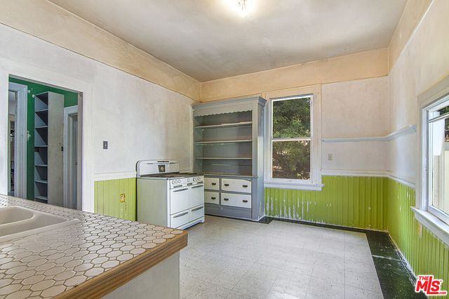 a bathroom with a sink toilet bathtub and mirror