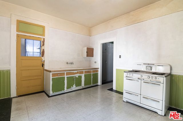 a view of door with wooden floor