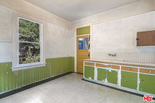 a view of a hallway with windows