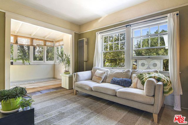 a living room with a couch and a table
