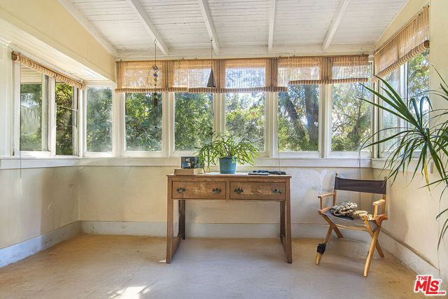 a kitchen with a refrigerator and a stove