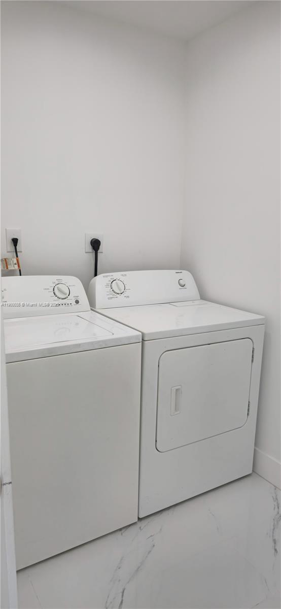 4404 Northwest 46th Way, Unit 4404 Tamarac, FL 33319 - Photo 18 of 27 a utility room with dryer and washer