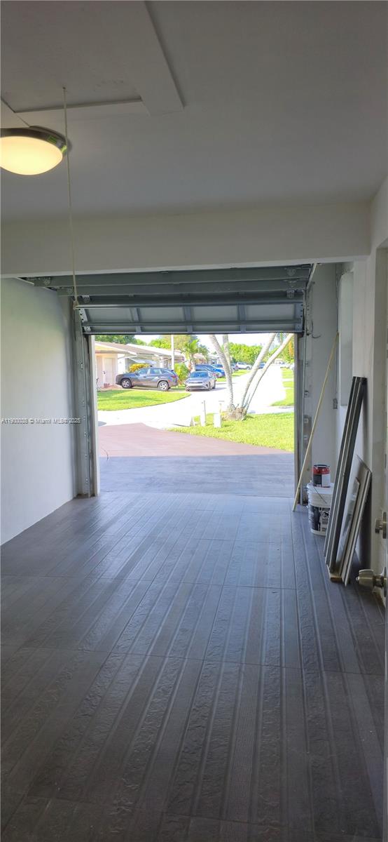 4404 Northwest 46th Way, Unit 4404 Tamarac, FL 33319 - Photo 19 of 27 a view of a room with wooden floor and a sink