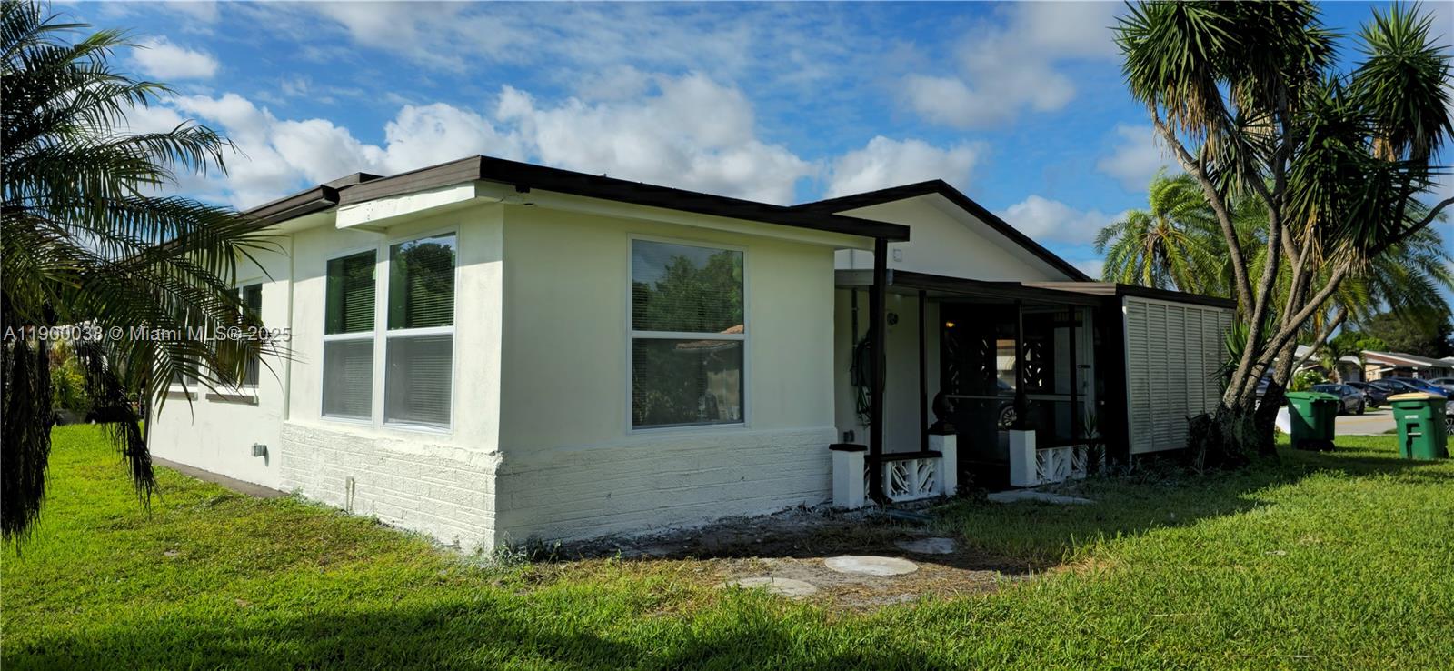 4404 Northwest 46th Way, Unit 4404 Tamarac, FL 33319 - Photo 24 of 27 a view of a house with a yard