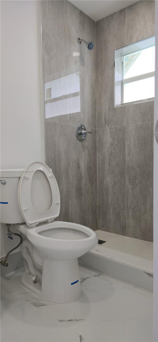 4404 Northwest 46th Way, Unit 4404 Tamarac, FL 33319 - Photo 10 of 27 a bathroom with a sink a toilet and a bathtub