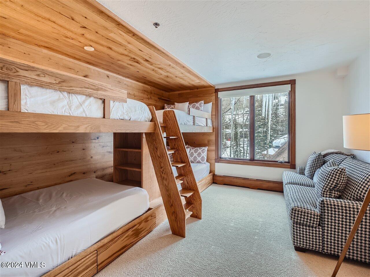 62 Highlands Lane, Unit R306 Beaver Creek, CO 81620 - Photo 19 of 32 a bedroom with furniture and a window