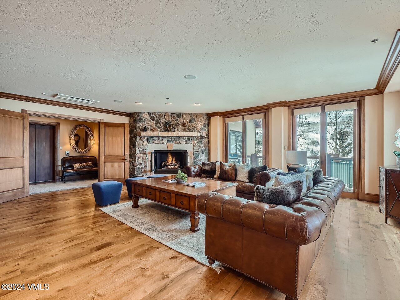 62 Highlands Lane, Unit R306 Beaver Creek, CO 81620 - Photo 2 of 32 a living room with furniture and a large window