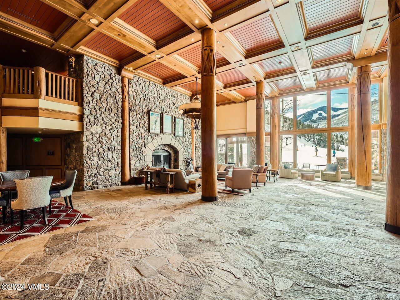 62 Highlands Lane, Unit R306 Beaver Creek, CO 81620 - Photo 24 of 32 a view of a room with gym equipment and large windows