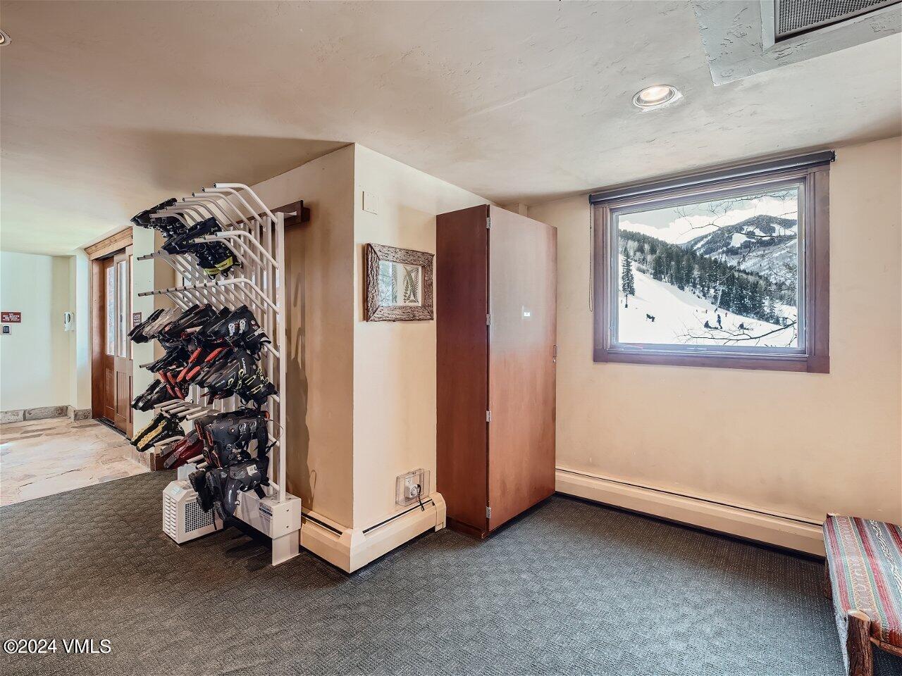 62 Highlands Lane, Unit R306 Beaver Creek, CO 81620 - Photo 26 of 32 a view of a livingroom with a furniture and a window