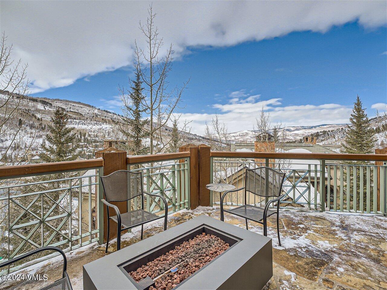 62 Highlands Lane, Unit R306 Beaver Creek, CO 81620 - Photo 8 of 32 a view of a chairs and table in the balcony